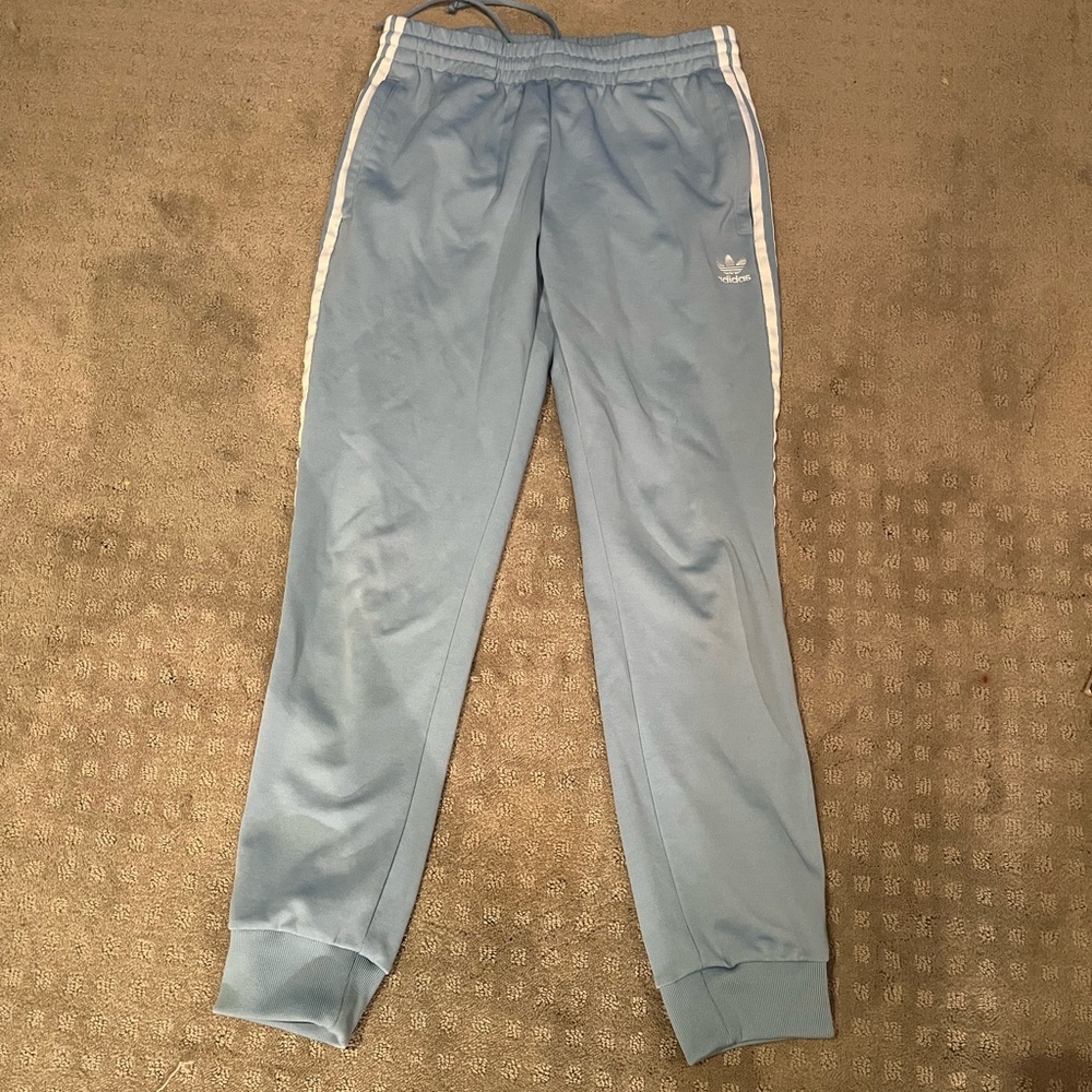 Adidas joggers. Sky blue. White stripes down the legs